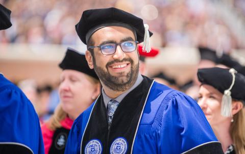 Male graduate student in graduation regalia